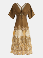 Elara™ | Vestido largo con estampado de paisley y lazo delantero